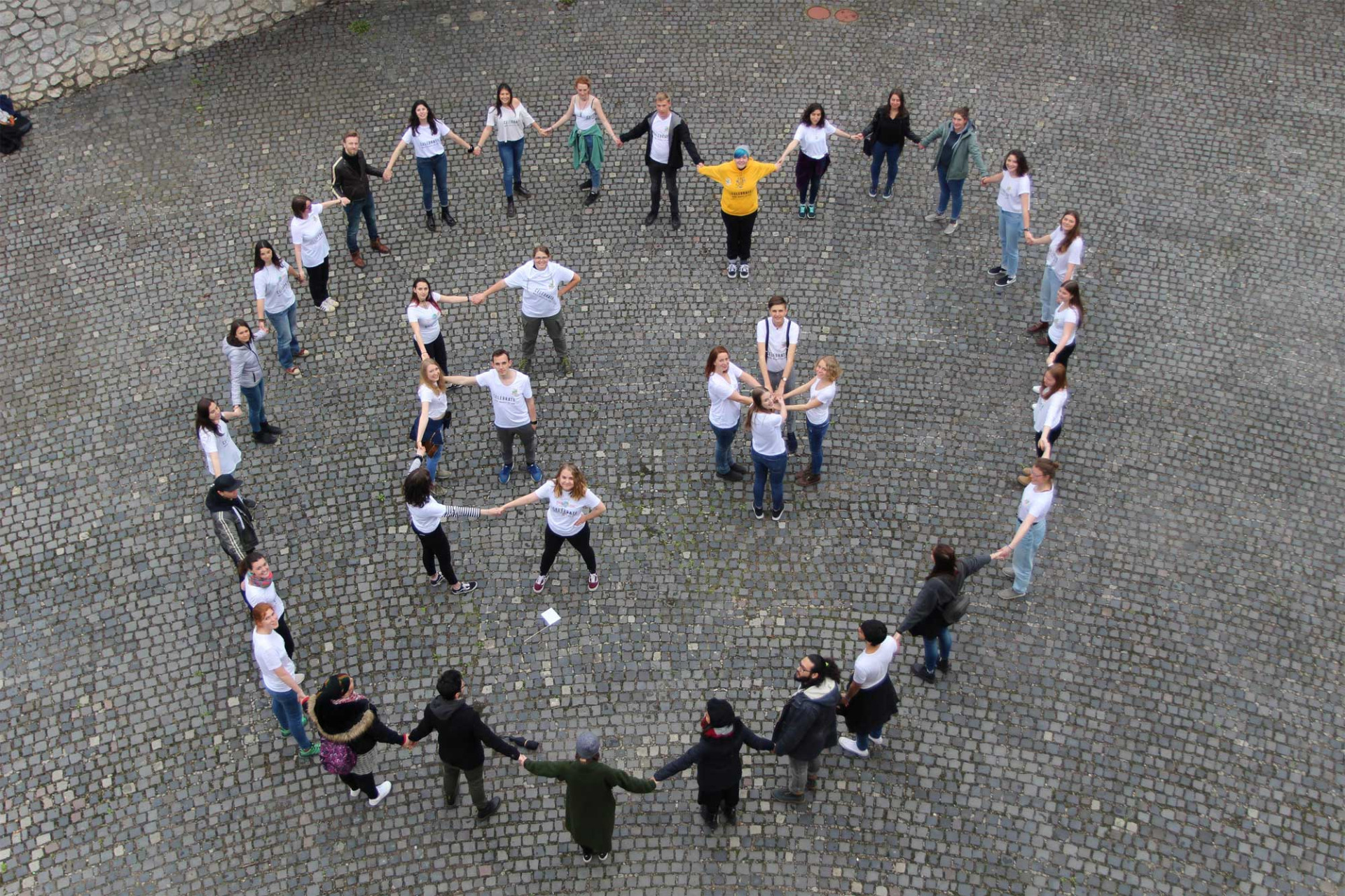 "We love Ersamus+" - E+ heart next to the remains of the old city wall of Pécs